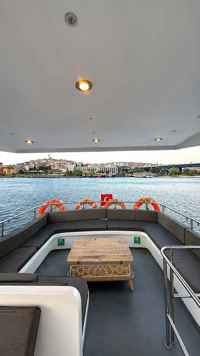 The shaded aft deck set for lunch, Golden Horn beyond